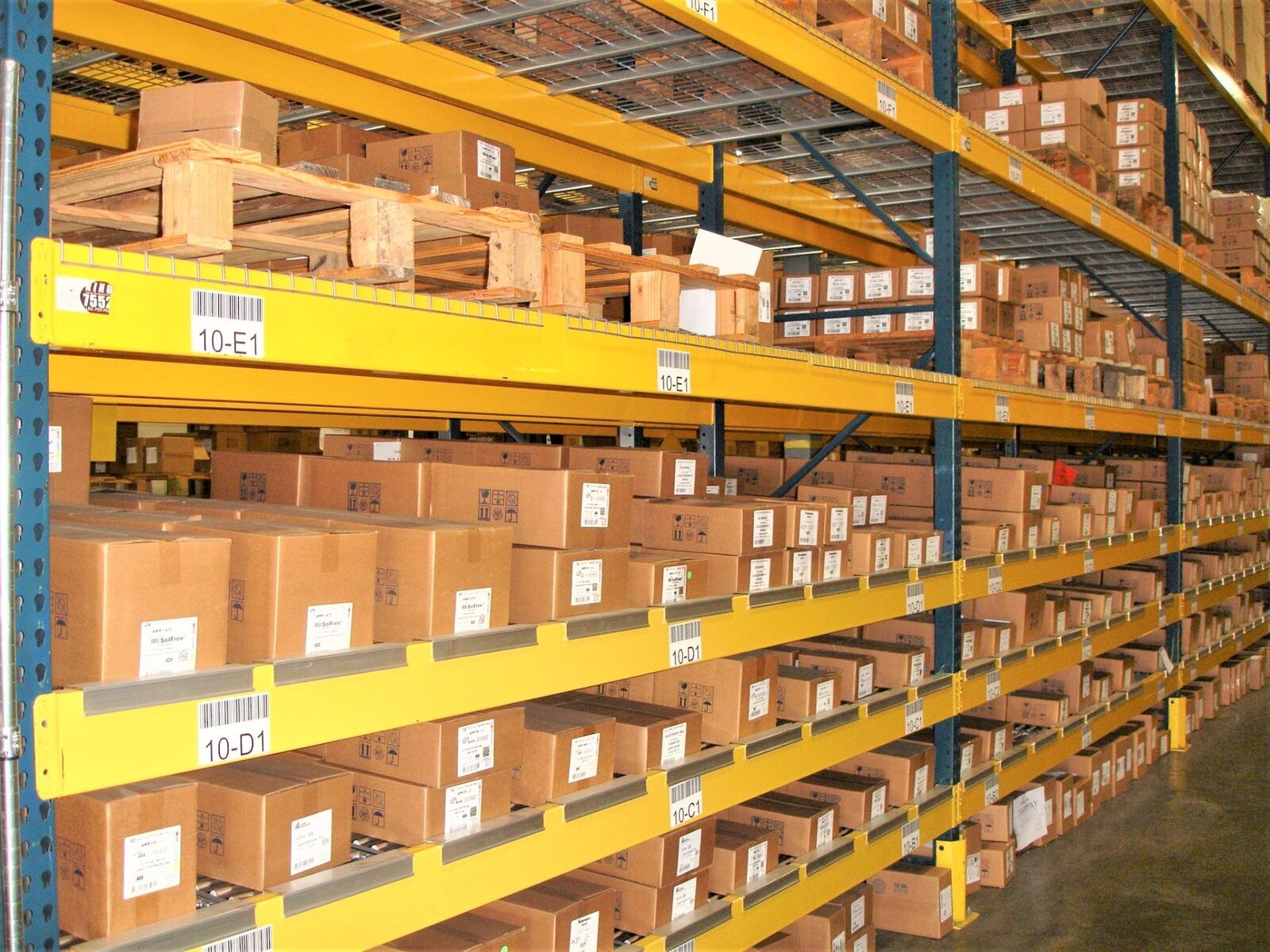 Carton flow rack system with labeled boxes in warehouse
