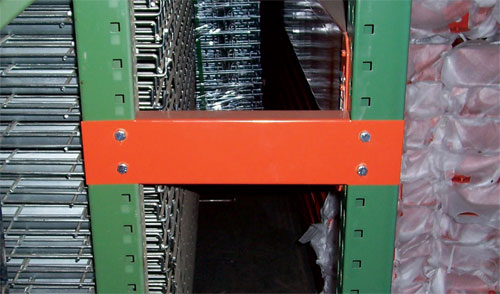 Row spacers for pallet rack stability
